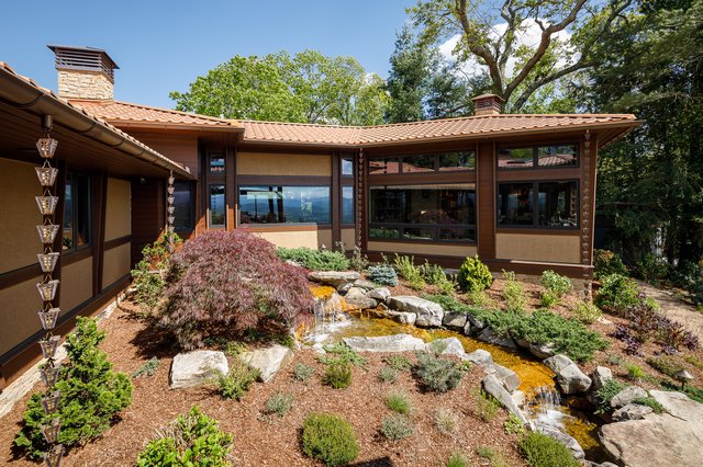 Beaucatcher Mountain manor exterior with water feature