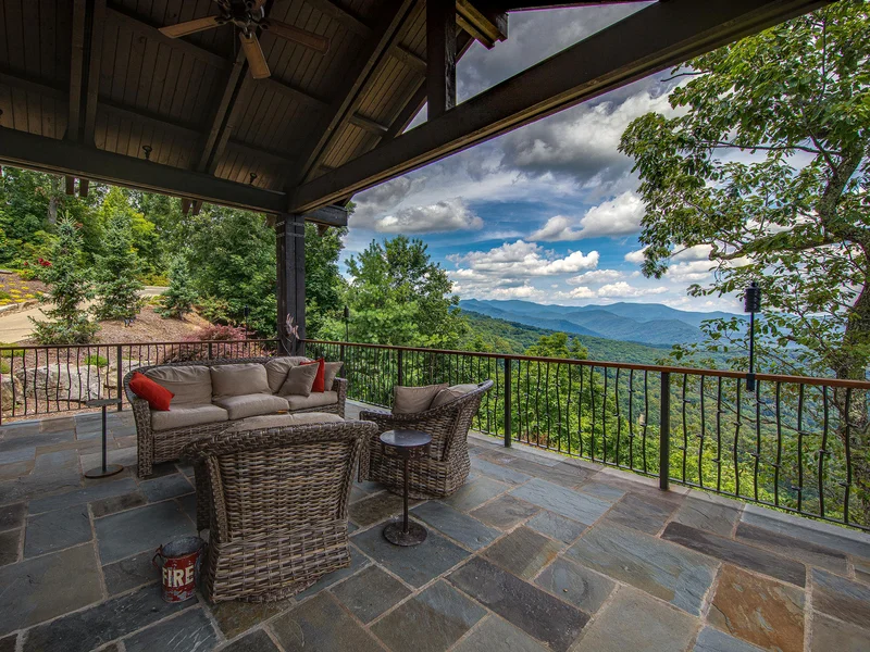 A slate floored, covered patio with a view makes the experience of living in the Blue Ridge Mountains all the better.