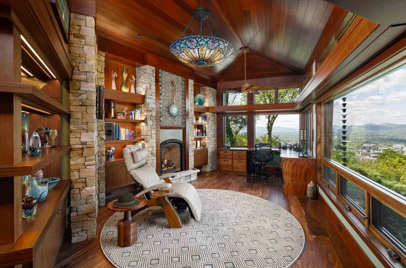 Interior sitting room with fine wood details and a wall of windows