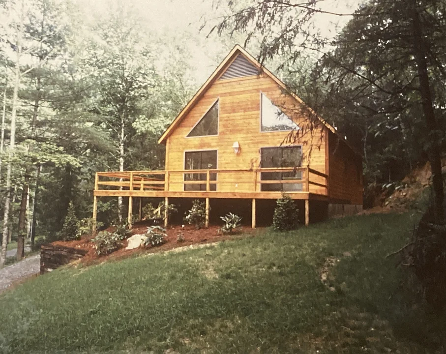 A cedar-sided home built by Malcolm and Kevin in the mid-to-late-80s in the River Ridge Community.