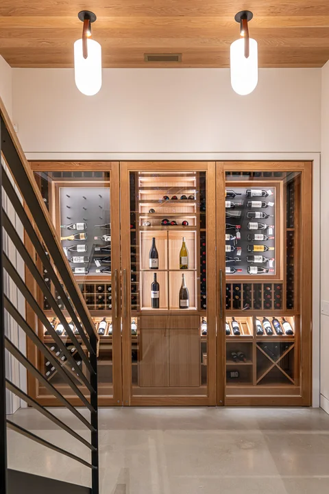 Wine cellar wall in Lake Toxaway Modern Custom Home