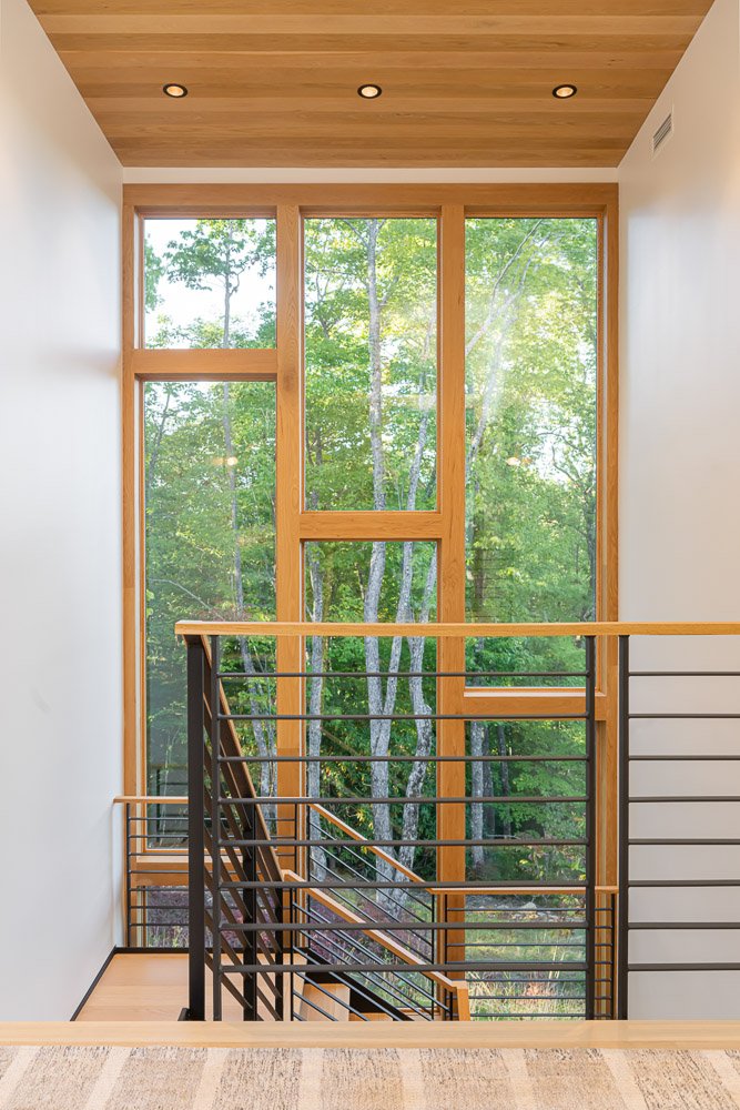 Two story picture windows in custom home at Lake Toxaway