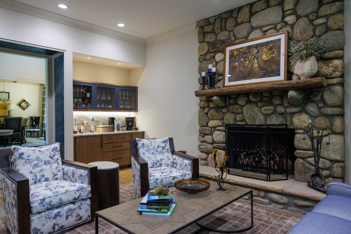 Renewed Family Home Sitting Area with Stone Hearth