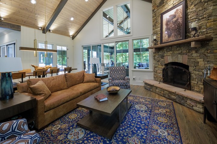 Renewed Family Home Sitting Area with Stone Fireplace