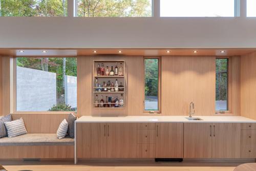 Wall of white oak cabinetry in Lake Toxaway Modern Custom Home
